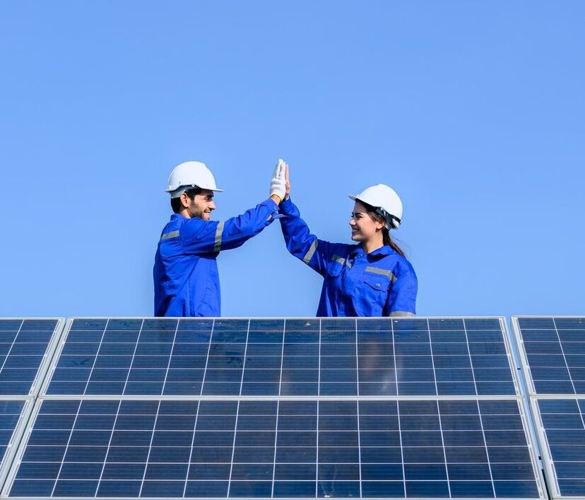 Solar panel station, Engineer installing solar panel at solar energy farm field